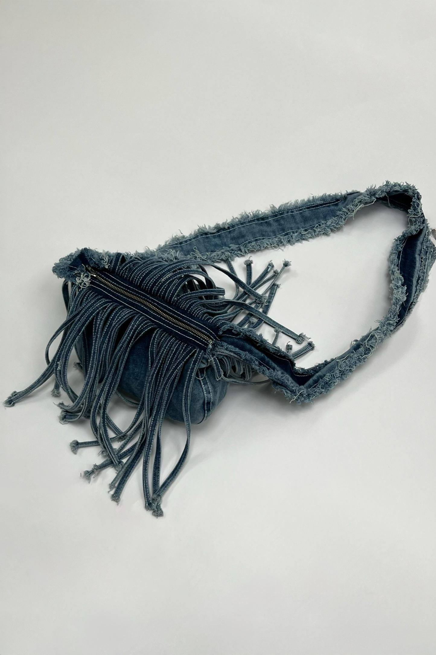 FRINGE DENIM SLING BAG BLUE