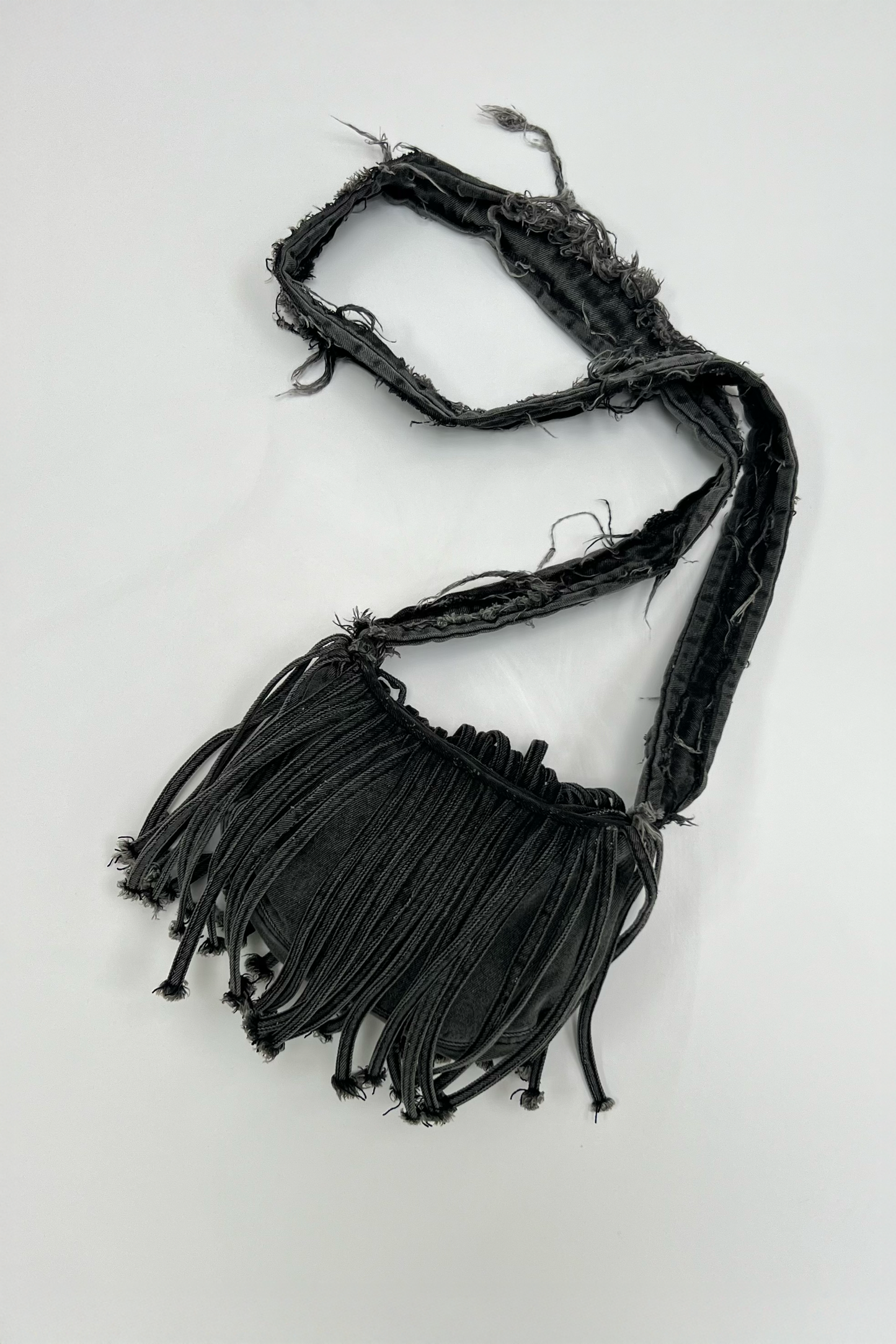 FRINGE DENIM SLING BAG IN ASH GREY